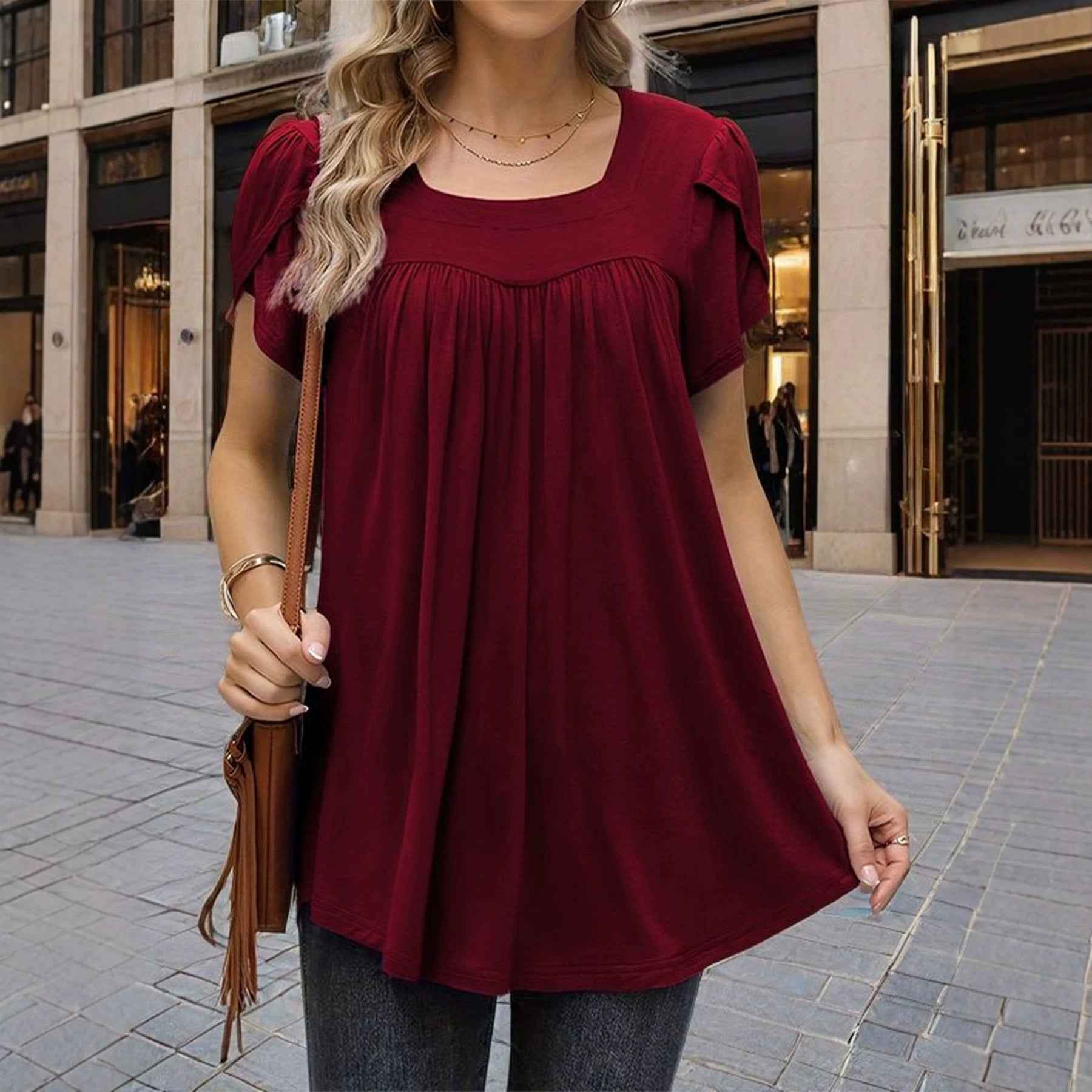 The Woman Is Wearing A Breathable Comfortable Top With Bubble Sleeves