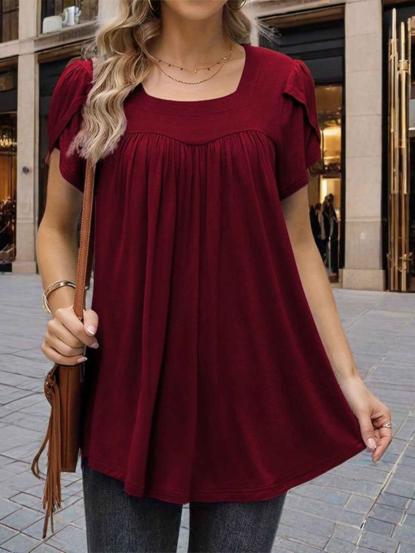 The Woman Is Wearing A Breathable Comfortable Top With Bubble Sleeves