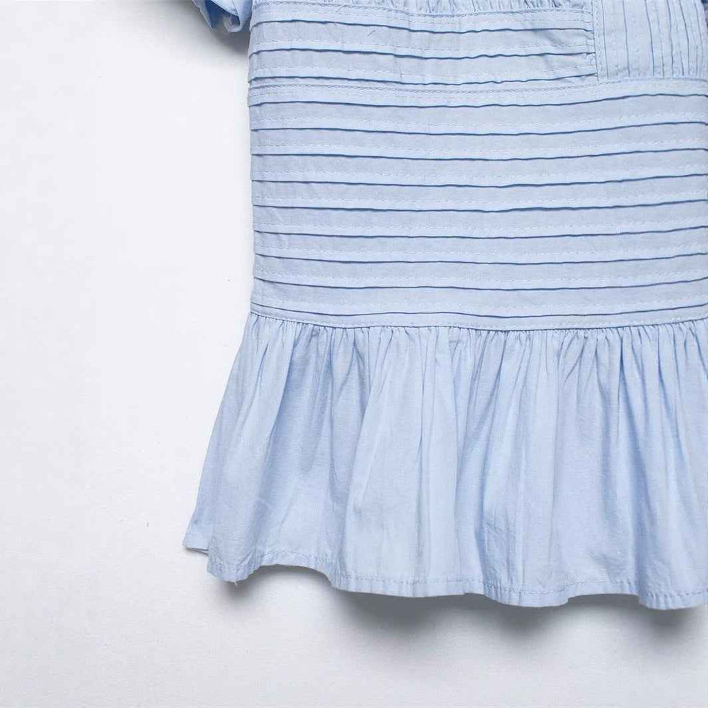 Ruffle-Trimmed Sleeveless Blouse