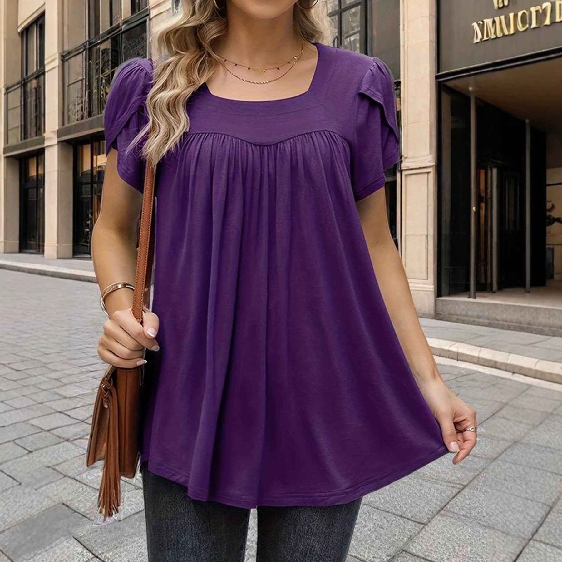 The Woman Is Wearing A Breathable Comfortable Top With Bubble Sleeves