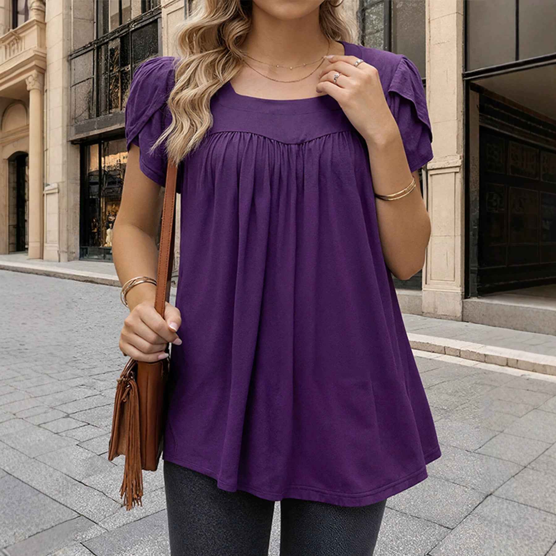 The Woman Is Wearing A Breathable Comfortable Top With Bubble Sleeves